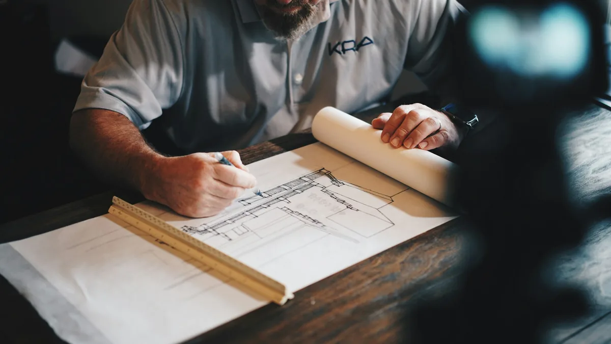 Architectural blueprint planning representing strong foundations and discipline in numerology