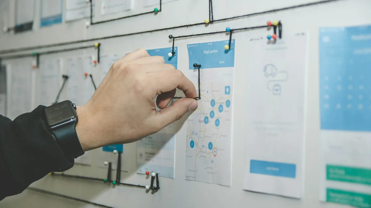 Software engineer and technical specialist utilizing AI assistance for code auditing and interface wireframing