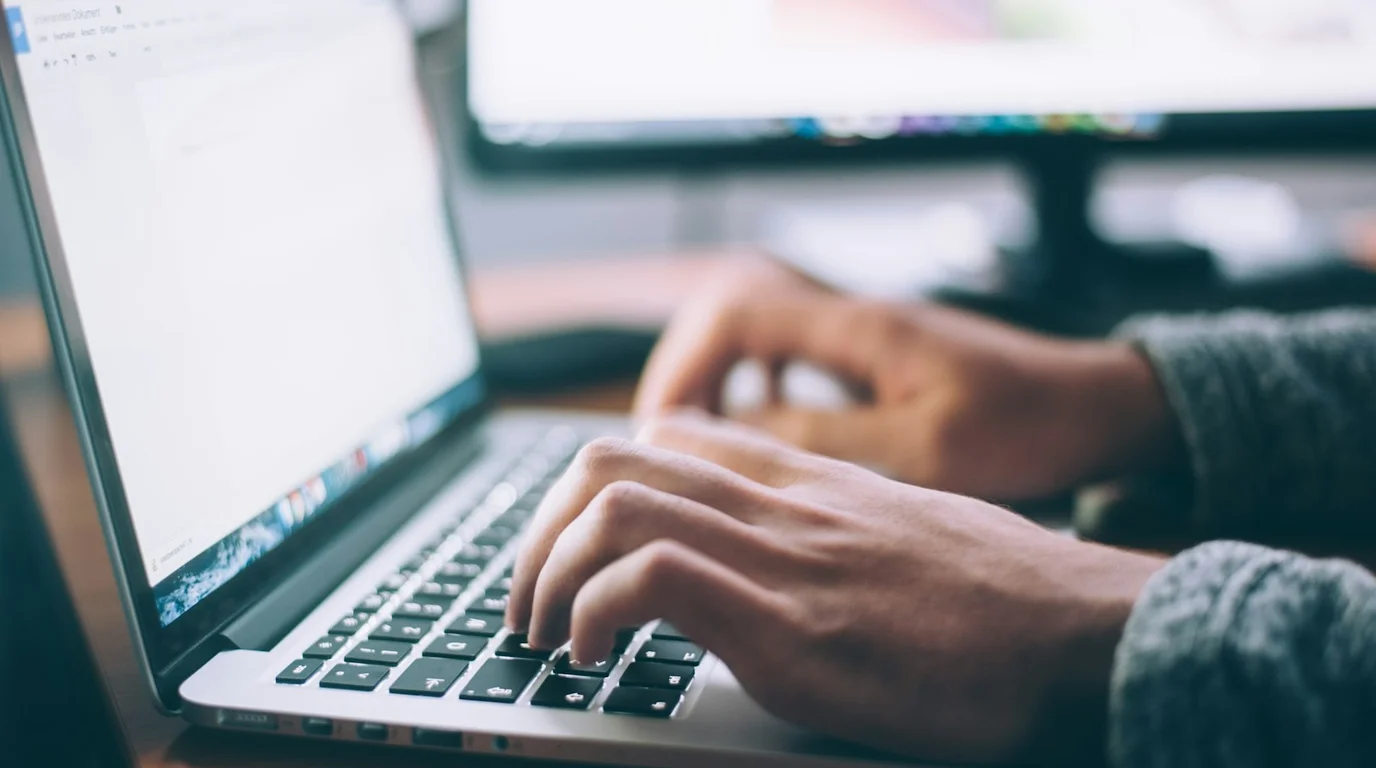 User browsing online platform on modern laptop with secure HTTPS web browser connection