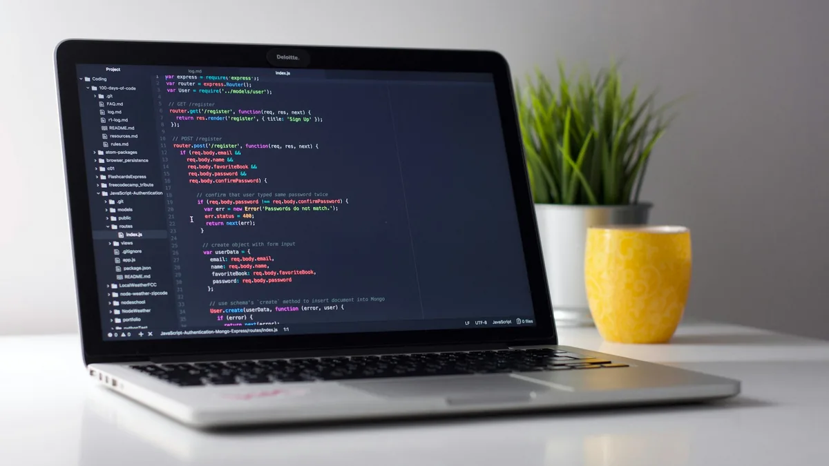 Writer using digital grammar checker and clarity editing tools on laptop