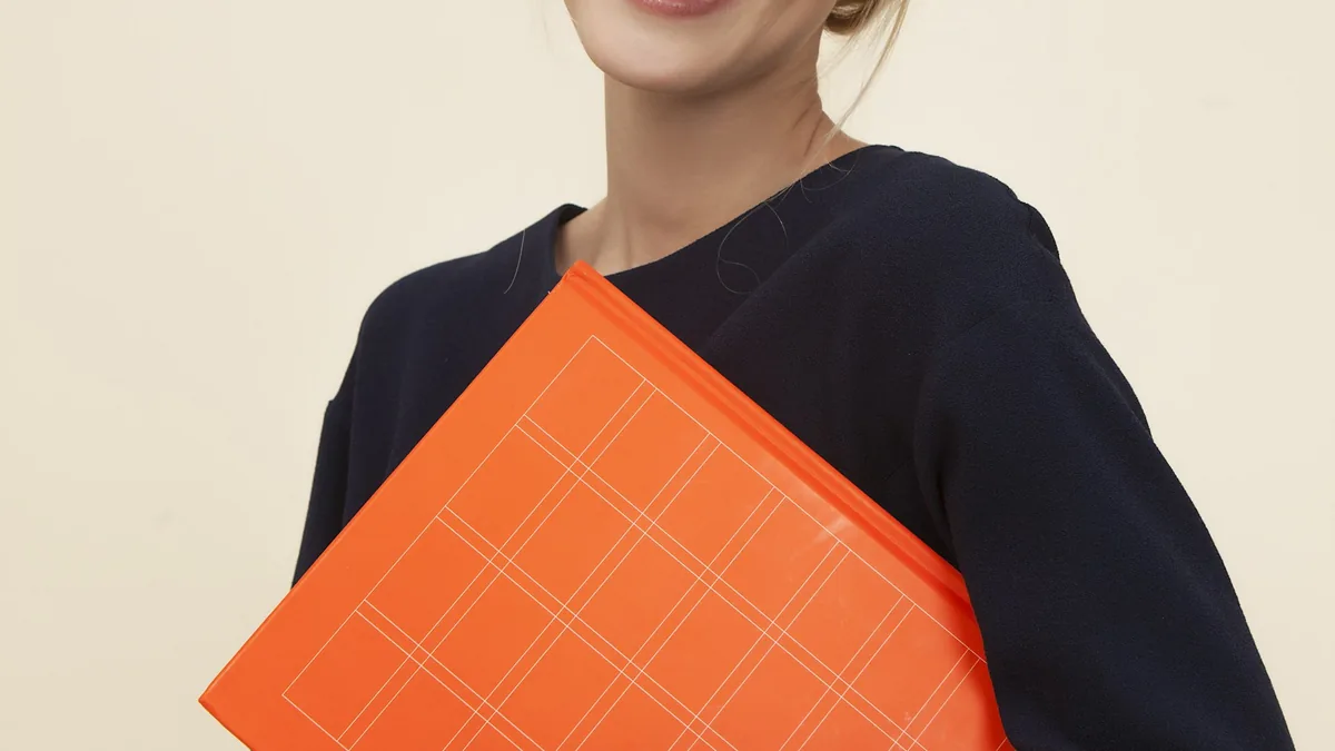 Modern tablet and stylus displaying digital notebook workspace alongside a publishing blog