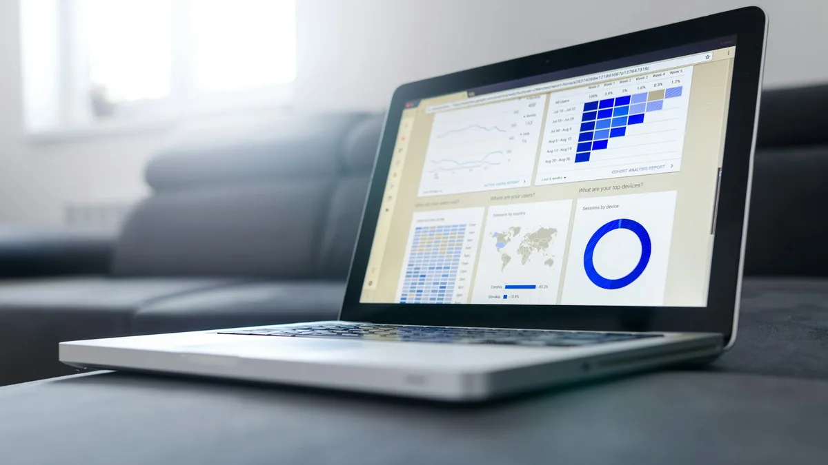 Digital marketer analyzing SEO metrics, search intent, and organic traffic growth on laptop